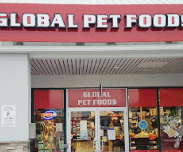 a pet food store with a red awning.