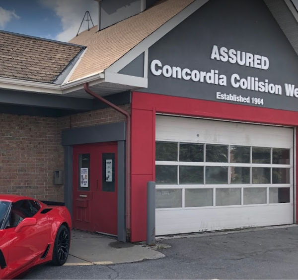 a red sports car parked in front of a building.
