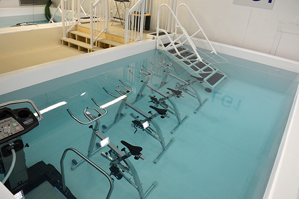 a swimming pool with a bunch of bikes in it.