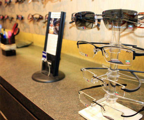 a pair of glasses sitting on top of a display case.