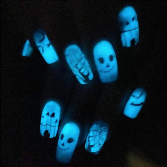 glow in the dark nails with skulls on them.