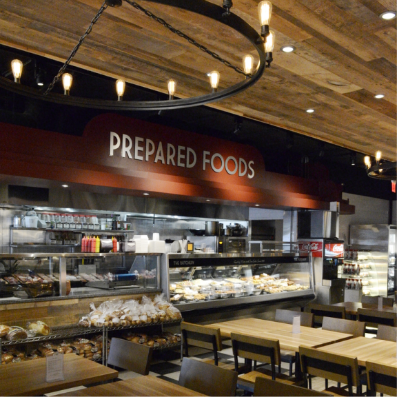 prepared foods section with restaurant seating