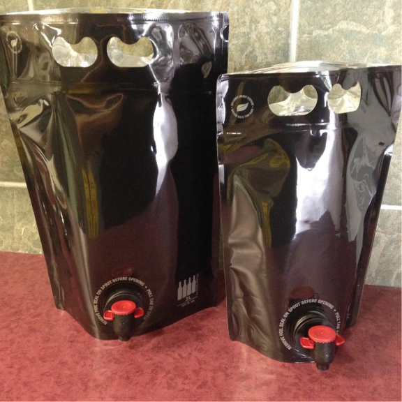 a couple of bags of wine sitting on top of a counter.