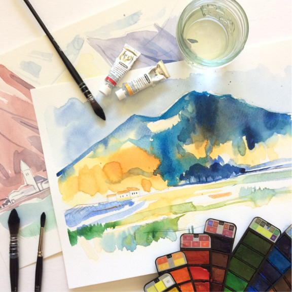 a painting of a mountain with watercolors on it.