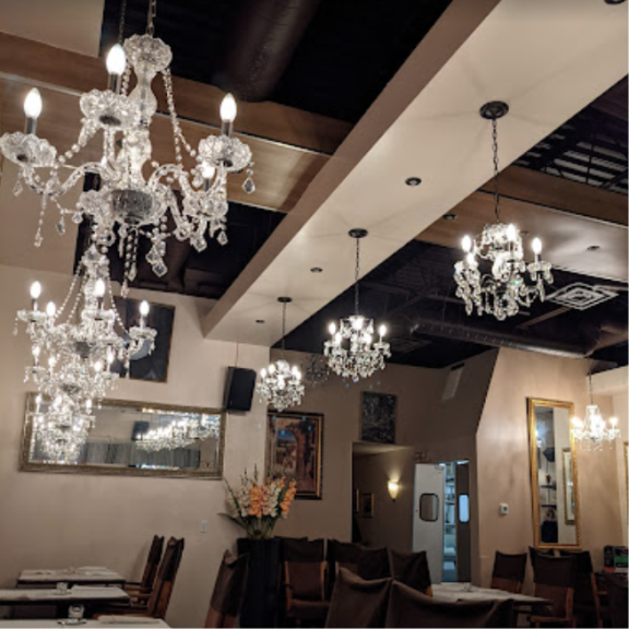 restaurant interior with low beams and crystal chandaliers