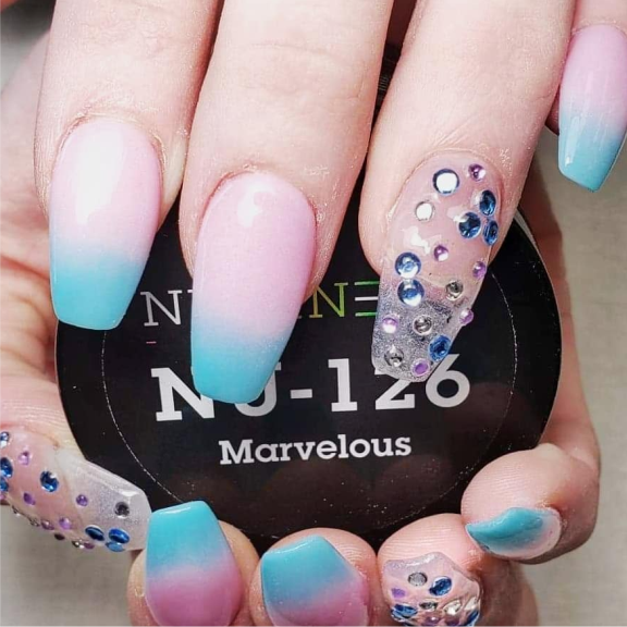 a person with blue and pink nail polish on their nails.