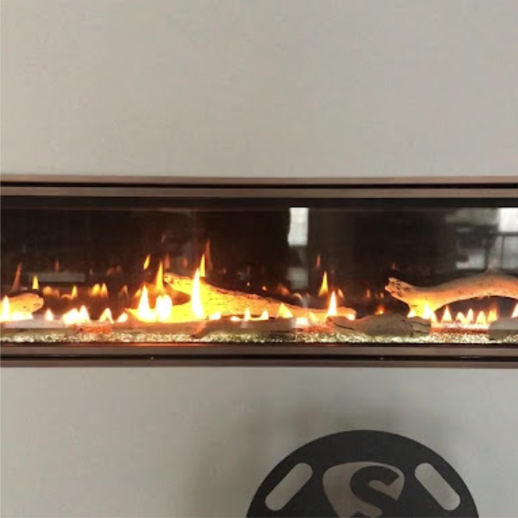 a fire burning in a fireplace in a room.