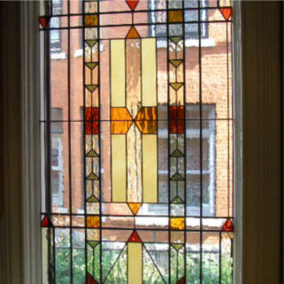 a close up of a stained glass window.