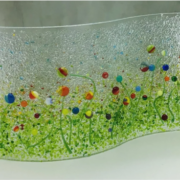 a glass sculpture of a field of flowers.
