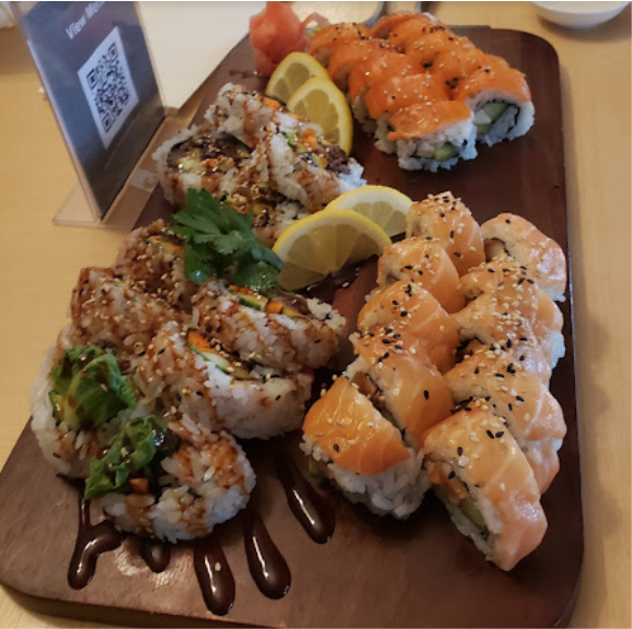 Sushi and Sashimi rolls garnished with sesame seeds