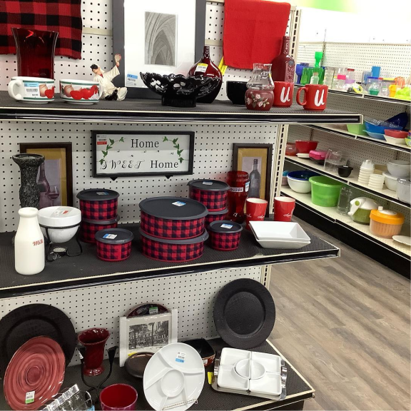 a store shelf filled with lots of different houseware items.