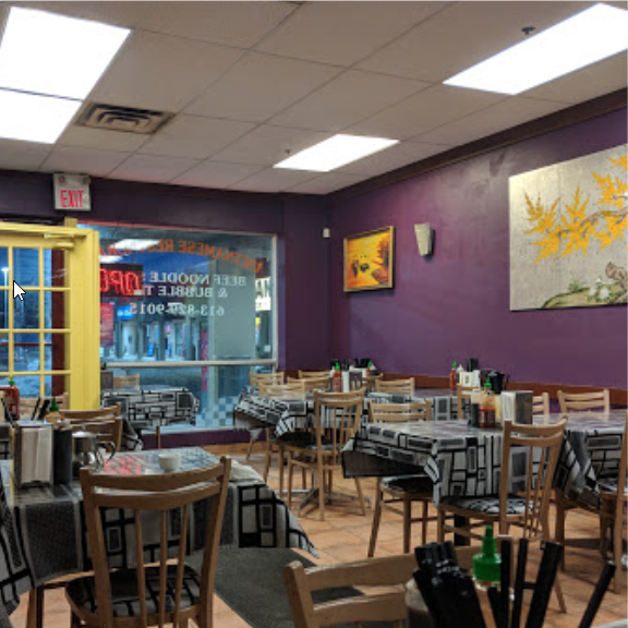 Restaurant interior with purple walls and yellow accents