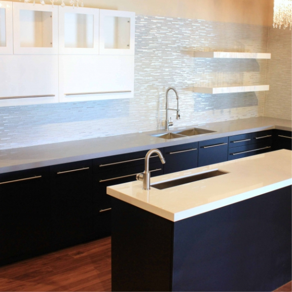 a kitchen with a sink and a counter top.