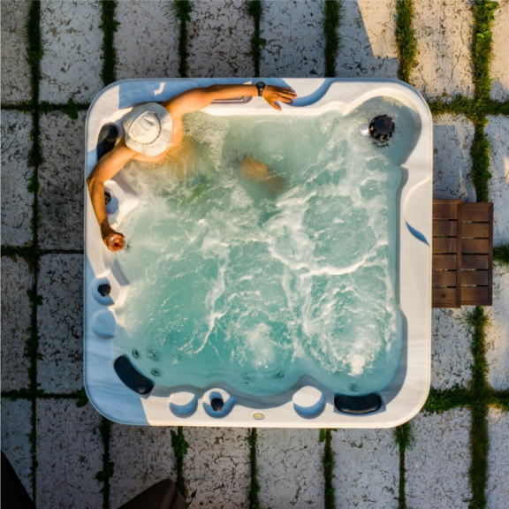 a person laying in a hot tub