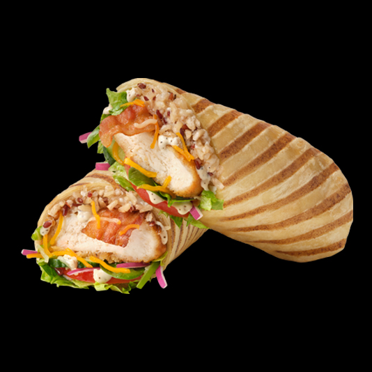 a chicken wrap sandwich with meat, cheese, lettuce and tomato.