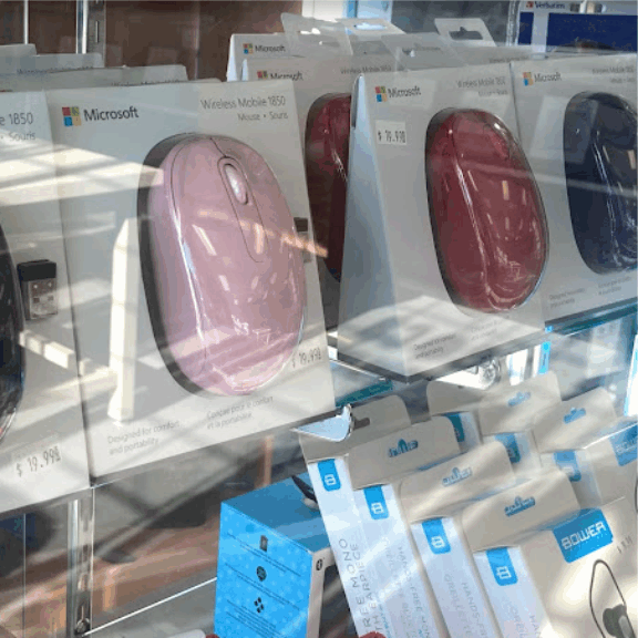 a store window with a display of computer mouses.
