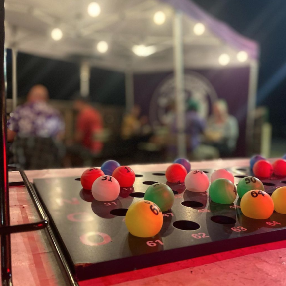 a close up of a table with bingo balls on it.