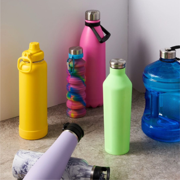 a group of different colored water bottles next to each other.