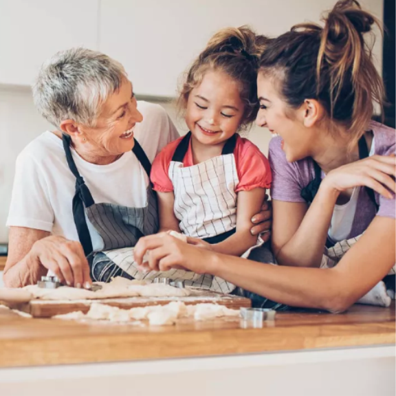 three generations of women baking together