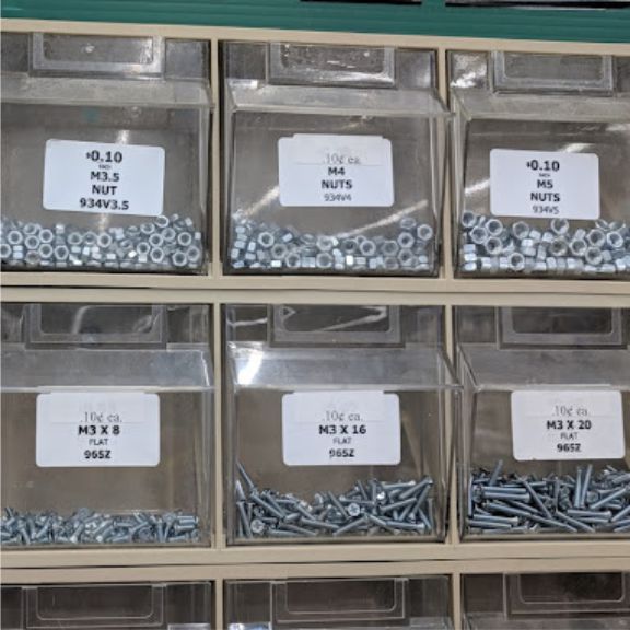 closeup of small bins of nuts, bolts and screws