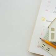 Arrangement of calendar, calculator, and small house