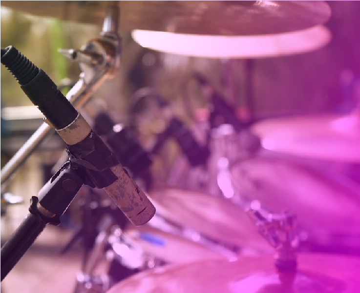 A close up of a drum set with a microphone.