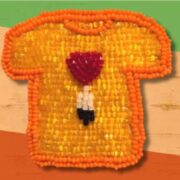 A beaded t - shirt with a heart on it.