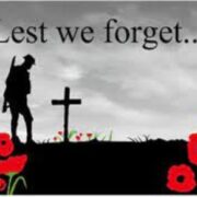 A remembrance day card with the words lest we forget.