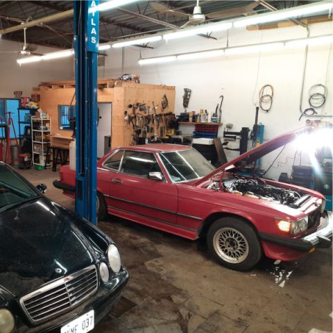 A mercedes benz in a garage.