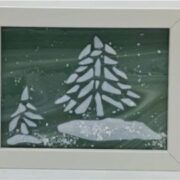 A white frame with a snowy scene on it.