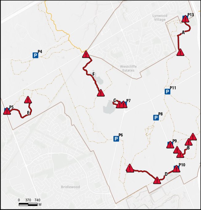 A map of a trail with red arrows on it.