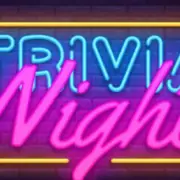 Neon sign with the words "Trivia Night" in blue and pink against a dark brick background.