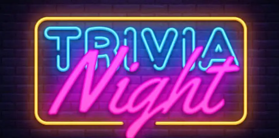 Neon sign with the words "Trivia Night" in blue and pink against a dark brick background.
