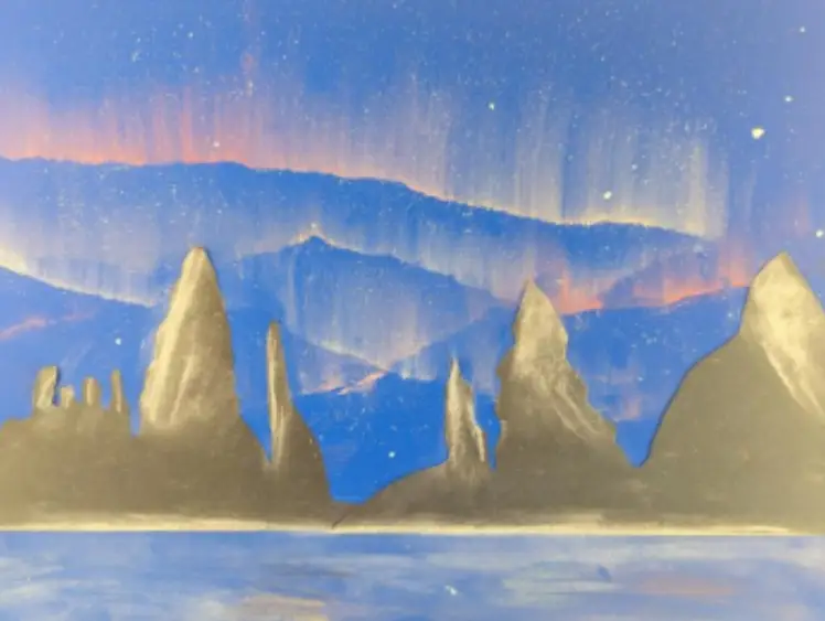 A painting depicts jagged mountains with a blue and orange sky in the background. The sky appears to show an aurora.