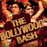 Two performers in golden outfits strike a dance pose beneath a large text reading "THE 'BOLLYWOOD' BASH" with a vibrant background.